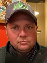 A man named Marty, wearing a hat and jacket.